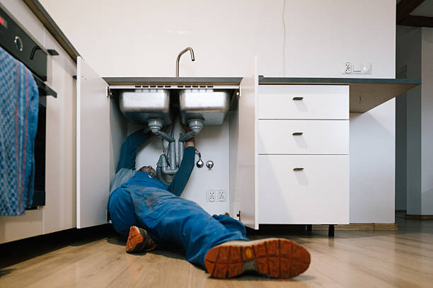 Professional Drain Cleaning technician working in Russell, KS